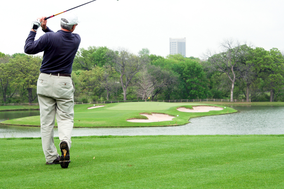 man swinging a golf clup